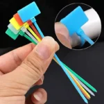 Multi-color self-locking writable cable ID tags for wire organization.