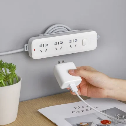 Adhesive mount power strip with 3 universal outlets and cable management
