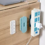 Adhesive mount power strip with 3 universal outlets and cable management