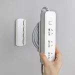 Adhesive mount power strip with 3 universal outlets and cable management
