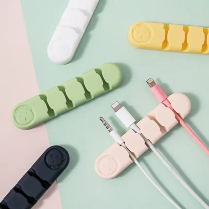 Cute animal face silicone adhesive multi-slot cable organizer and cord holder.