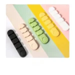 Cute animal face silicone adhesive multi-slot cable organizer and cord holder.