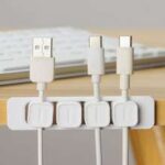 Desk cable organizer kit, adhesive, magnetic, clip-on for tidy workspace.