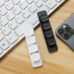 Desk cable organizer kit, adhesive, magnetic, clip-on for tidy workspace.