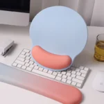 Ergonomic keyboard and mouse wrist rest set with pastel gradient colors.
