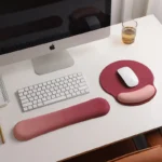 Ergonomic keyboard and mouse wrist rest set with pastel gradient colors.