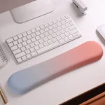 Ergonomic keyboard and mouse wrist rest set with pastel gradient colors.