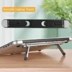 Invisible adhesive laptop stand elevating a silver laptop