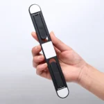 Invisible adhesive laptop stand elevating a silver laptop