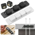Magnetic cable organizer clips with adhesive base strip for desk.