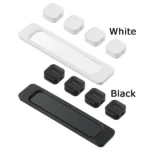 Magnetic cable organizer clips with adhesive base strip for desk.