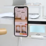 Clear acrylic monitor shelf with phone holder and desk organizer.