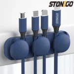 Adhesive silicone cable organizer for desk and wall management.