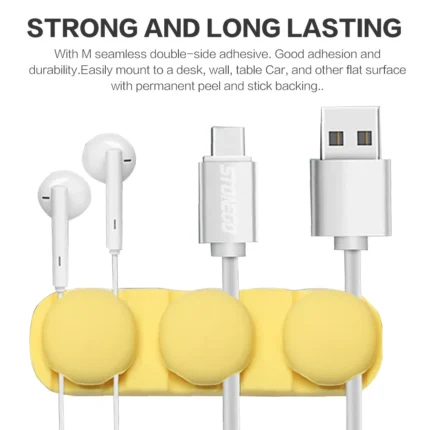 Adhesive silicone cable organizer for desk and wall management.