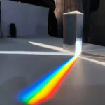 Rainbow optical prism dispersing white light into spectrum