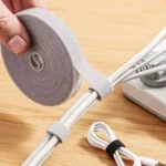 Reusable hook and loop cable ties in a roll for managing cables