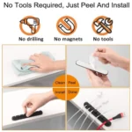Black silicone cable organizer with adhesive backing holding multiple cords