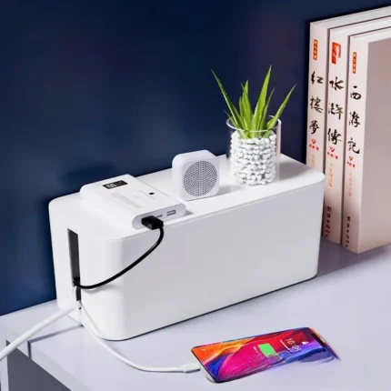 White smart cable management box, digital power monitor, charging phone.