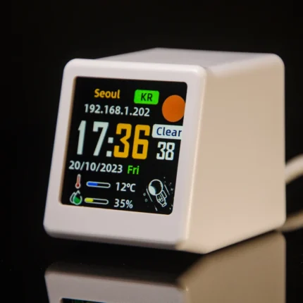 Smart WiFi desktop weather station and digital clock in yellow.