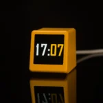 Smart WiFi desktop weather station and digital clock in yellow.