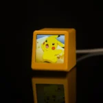 Smart WiFi desktop weather station and digital clock in yellow.