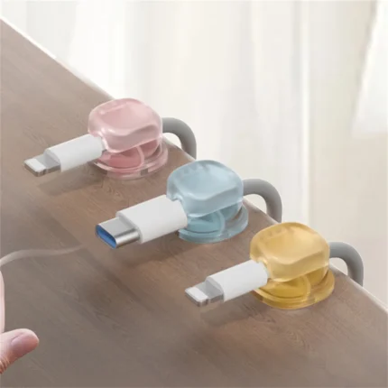 Self-adhesive translucent pastel cable clips for desk organization.
