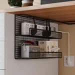 Black wire mesh under desk cable management tray