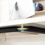 Under-desk cable management channel with self-adhesive backing.