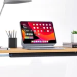 Under-desk cable management channel with self-adhesive backing.