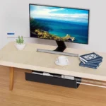 Under-desk cable management channel with self-adhesive backing.