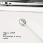 Magnetic adhesive wall mount holding a remote control and cable