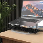 Ergonomic 2-in-1 laptop stand with keyboard storage for desk organization.