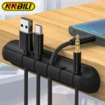 Adhesive desk cable organizer clips holding multiple data and charging cables