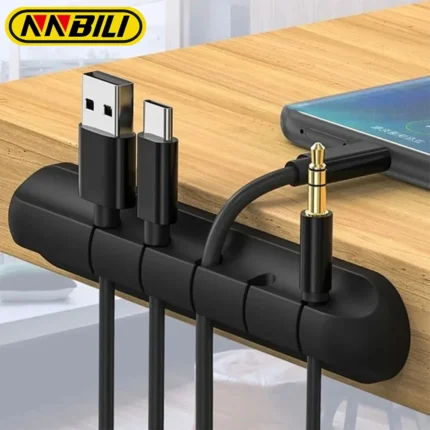 Adhesive desk cable organizer clips holding multiple data and charging cables