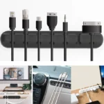 Adhesive desk cable organizer clips holding multiple data and charging cables