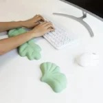 Mint green ergonomic desk set with leaf wrist rests and keyboard