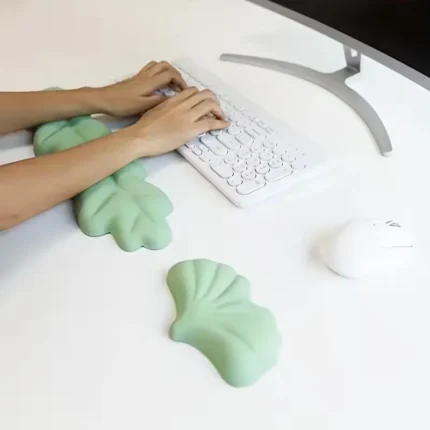 Mint green ergonomic desk set with leaf wrist rests and keyboard