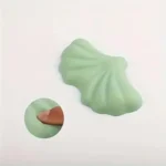 Mint green ergonomic desk set with leaf wrist rests and keyboard