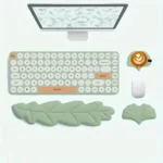 Mint green ergonomic desk set with leaf wrist rests and keyboard