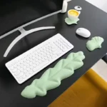 Mint green ergonomic desk set with leaf wrist rests and keyboard