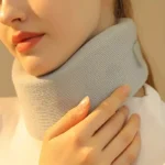 Soft grey cervical neck support brace with adjustable strap