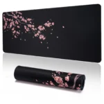 Large cherry blossom desk mat with non-slip base and stitched edges