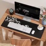 Large cherry blossom desk mat with non-slip base and stitched edges