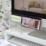 Clear acrylic monitor shelf with phone holder and sticky note display