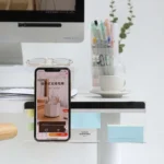Clear acrylic monitor shelf with phone holder and sticky note display