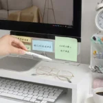 Clear acrylic monitor shelf with phone holder and sticky note display