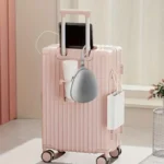 Compact egg-shaped hard shell travel case for foldable items