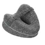 Contoured knee pillow for side sleepers with strap for leg support