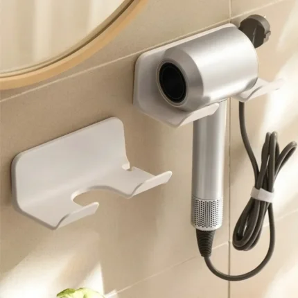 Wall-mounted hair dryer holder with cord management and accessory storage