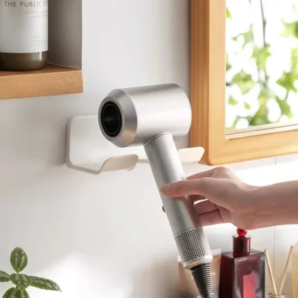 Wall-mounted hair dryer holder with cord management and accessory storage